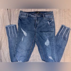 Distressed medium wash jeans